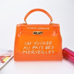 Un Voyage Handbag
